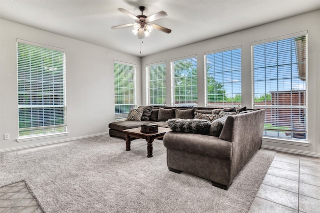 carpeted living room with ceiling fan