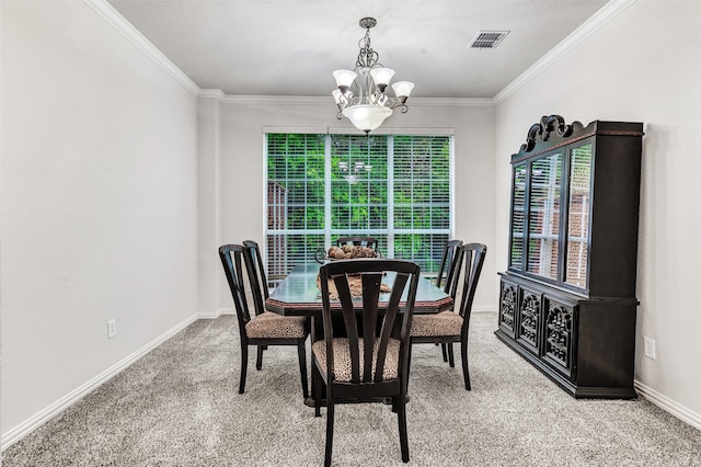 carpeted dining space with ornamental molding and a chandelier