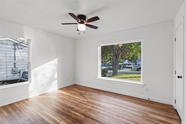 unfurnished living room with hardwood / wood-style floors and ceiling fan