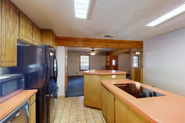 kitchen featuring black appliances, ceiling fan, light tile patterned flooring, and a textured ceiling