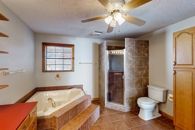 full bathroom with tile patterned floors, separate shower and tub, a textured ceiling, and toilet