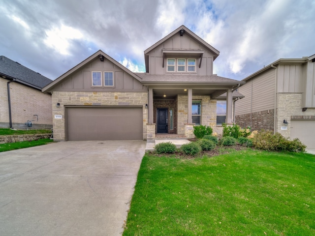 craftsman-style house featuring a garage, covered porch, and a front lawn