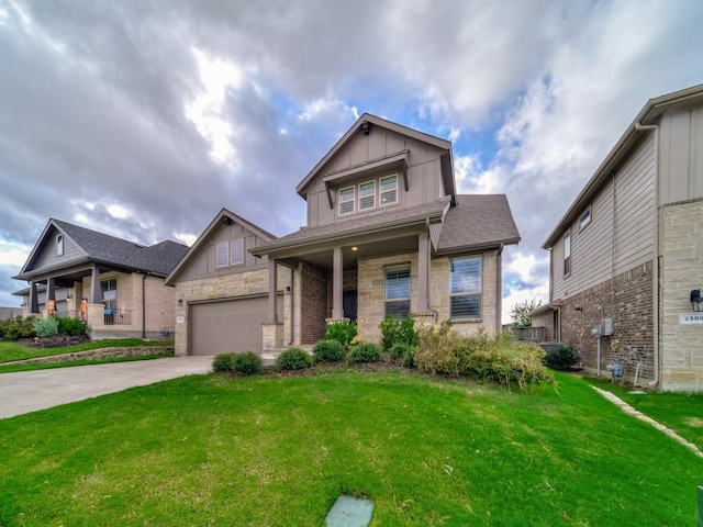 craftsman-style house with covered porch, a garage, and a front lawn