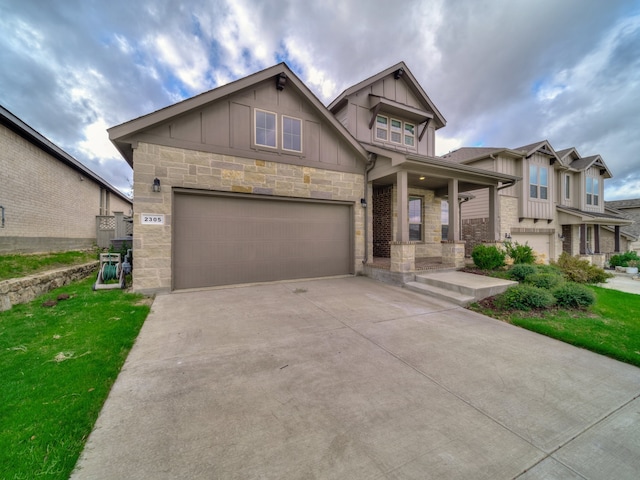 craftsman house with a porch and a garage