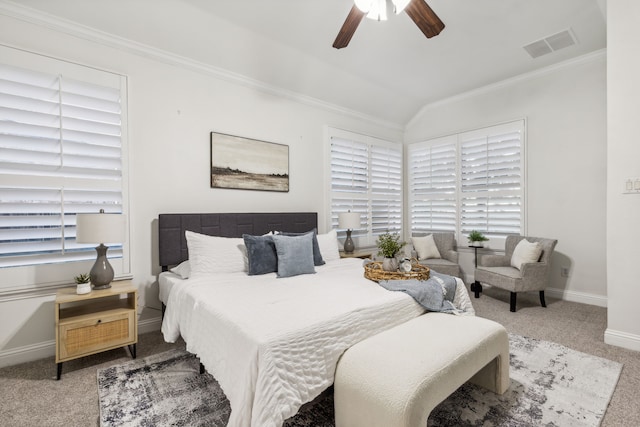 carpeted bedroom featuring vaulted ceiling, ceiling fan, and ornamental molding