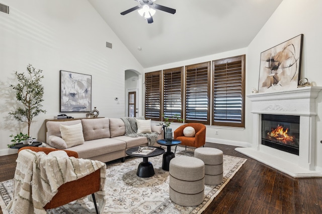 living room with hardwood / wood-style flooring, high vaulted ceiling, and ceiling fan