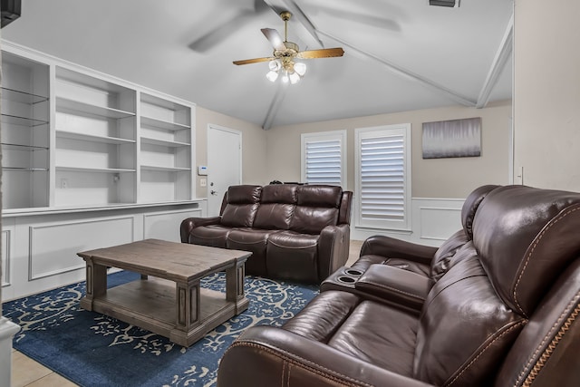 living room featuring lofted ceiling with beams and ceiling fan