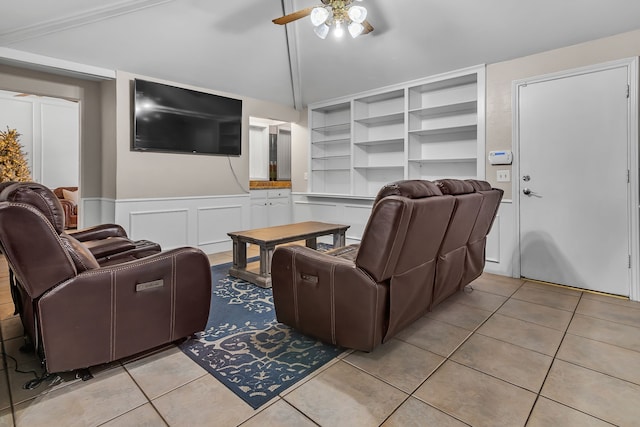 tiled living room with lofted ceiling and ceiling fan