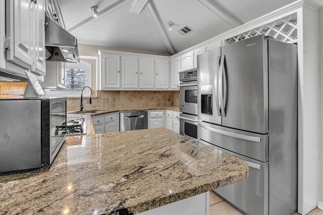 kitchen featuring sink, stone counters, island exhaust hood, stainless steel appliances, and white cabinets