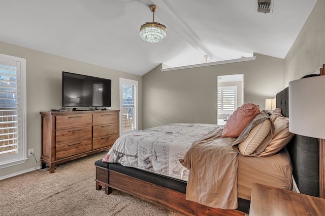 carpeted bedroom with vaulted ceiling with beams and a chandelier