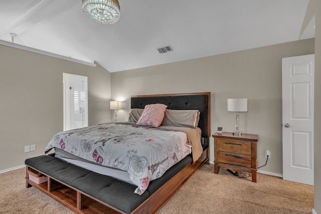 bedroom featuring vaulted ceiling and light colored carpet