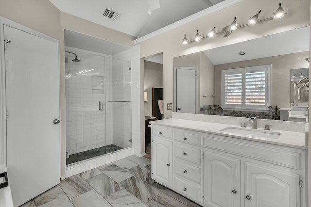 bathroom with vanity, an enclosed shower, and vaulted ceiling