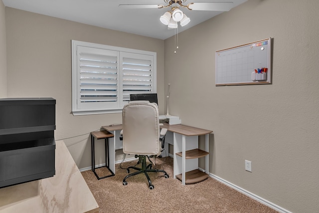 carpeted office with ceiling fan