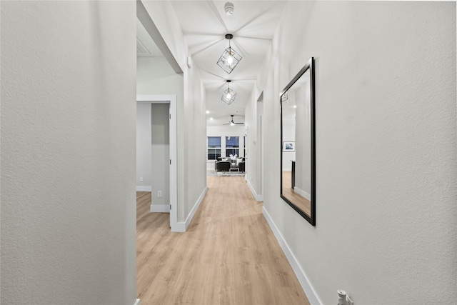 corridor with light hardwood / wood-style floors