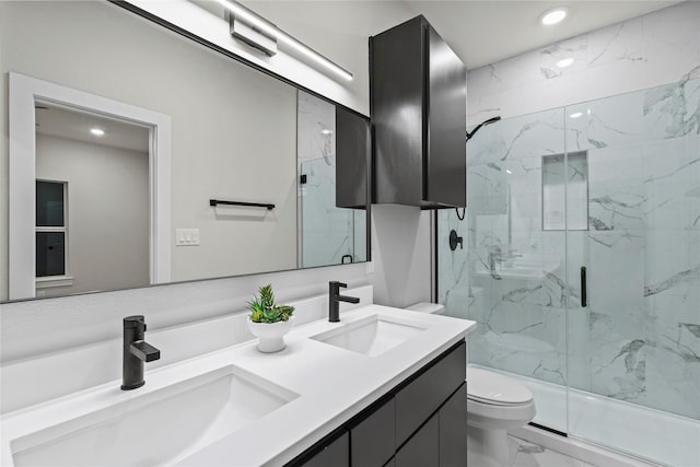 bathroom with vanity, toilet, and walk in shower