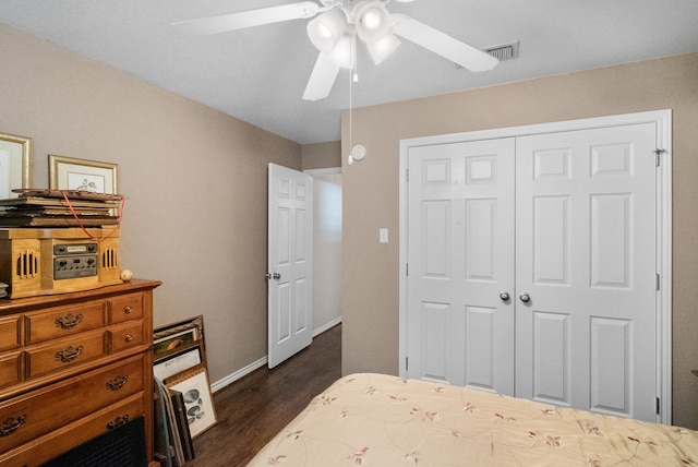 bedroom with ceiling fan, dark hardwood / wood-style flooring, and a closet