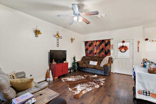 living room with dark hardwood / wood-style floors and ceiling fan