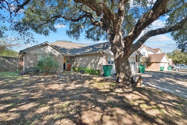 single story home with a garage