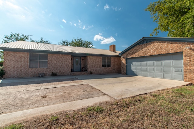 single story home featuring a garage