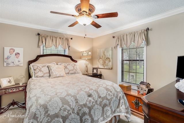 bedroom with carpet floors, multiple windows, ornamental molding, and ceiling fan