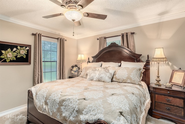 bedroom with carpet flooring, ceiling fan, crown molding, and a textured ceiling