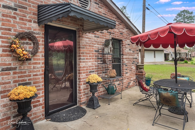 entrance to property featuring a patio