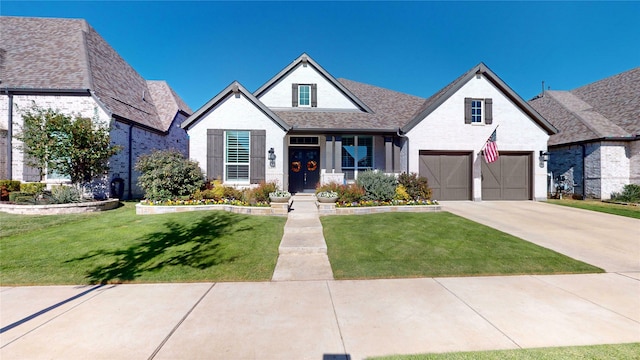 view of front of house featuring a front yard and a garage