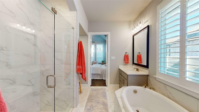 bathroom with vanity, a wealth of natural light, and independent shower and bath