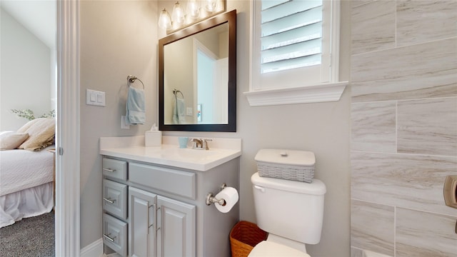 bathroom with vanity and toilet