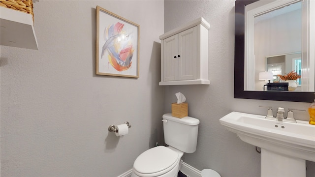 bathroom featuring sink and toilet