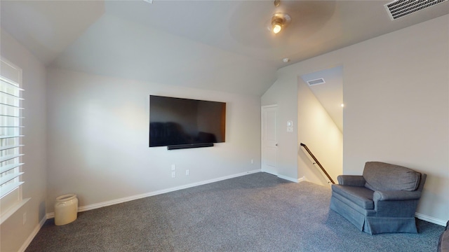 living area with carpet flooring and lofted ceiling