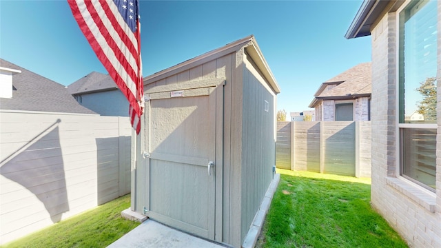 view of outbuilding with a yard