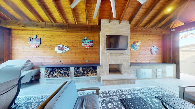 view of patio / terrace featuring an outdoor living space with a fireplace and ceiling fan