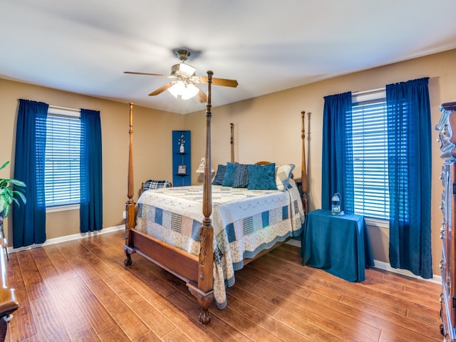 bedroom featuring hardwood / wood-style floors and ceiling fan