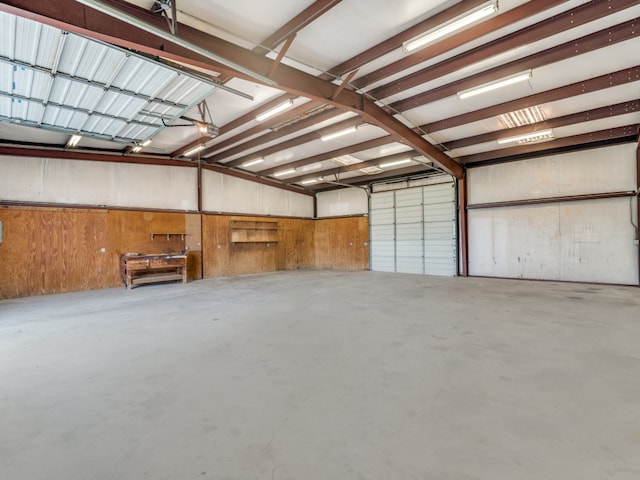 garage featuring wood walls