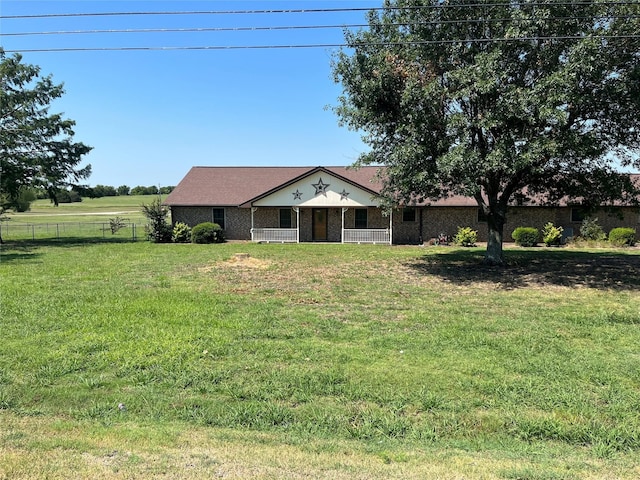 ranch-style house featuring a front lawn