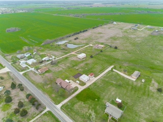 drone / aerial view with a rural view and a water view