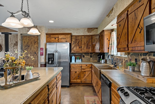 kitchen featuring decorative backsplash, appliances with stainless steel finishes, decorative light fixtures, and sink