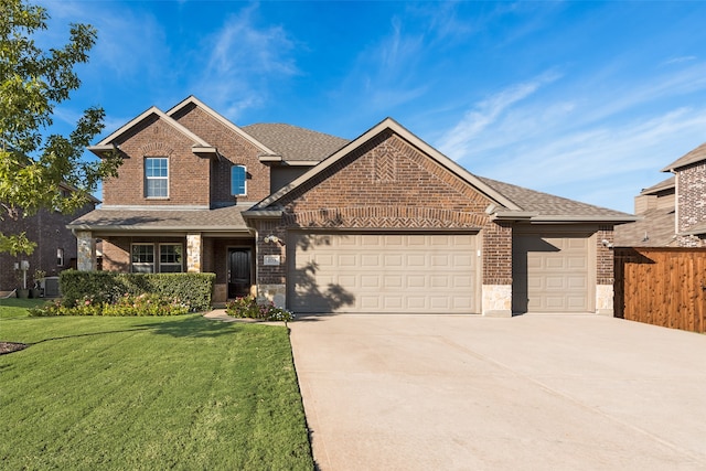 view of front facade with a garage and a front lawn