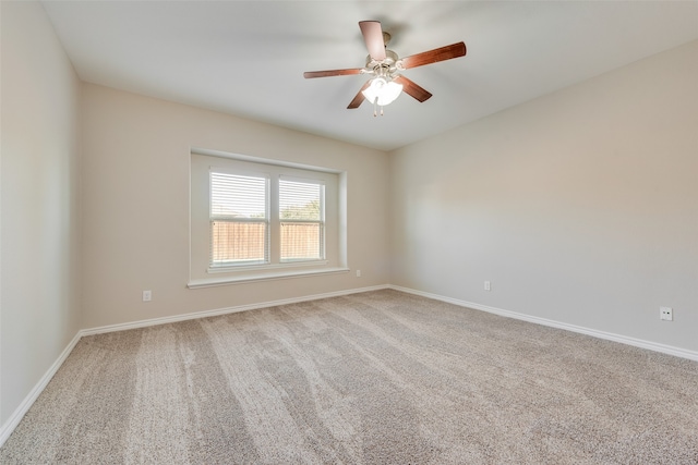 spare room featuring carpet and ceiling fan