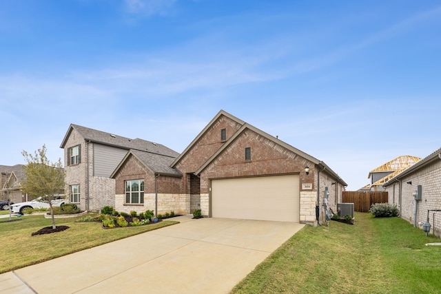 view of front of property featuring a garage, central air condition unit, and a front lawn