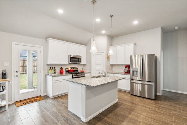 kitchen featuring sink, white cabinets, and appliances with stainless steel finishes