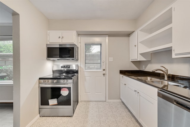 kitchen with sink, white cabinets, and stainless steel appliances