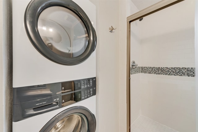 laundry area with stacked washer and dryer