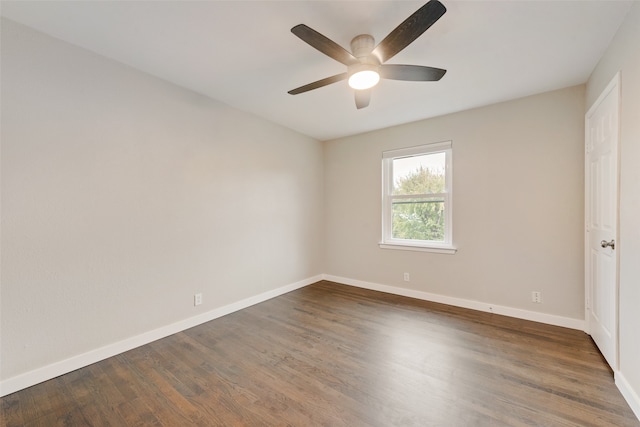 spare room featuring ceiling fan and dark hardwood / wood-style flooring