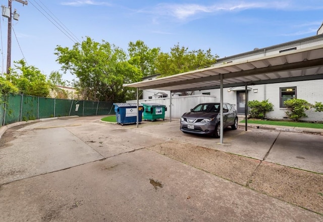 view of vehicle parking with a carport