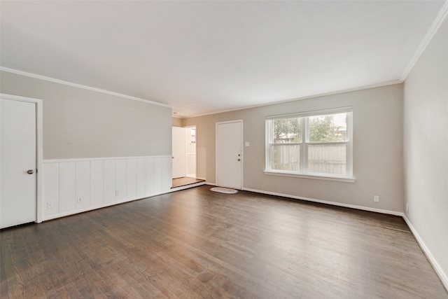 unfurnished room featuring dark hardwood / wood-style flooring and crown molding