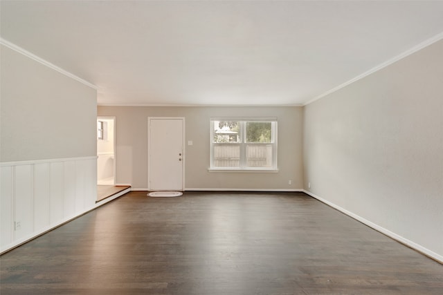 spare room with dark hardwood / wood-style floors and crown molding