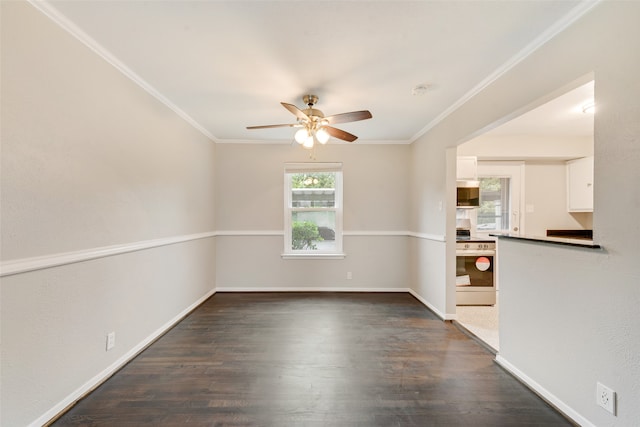 empty room with dark hardwood / wood-style floors, ceiling fan, and crown molding