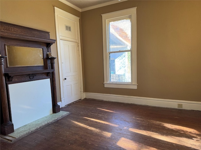 unfurnished room with dark hardwood / wood-style floors and ornamental molding